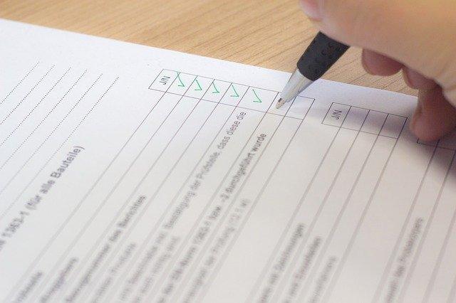 Someone checking items off on a checklist